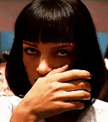 Uma Thurman biting her nails
