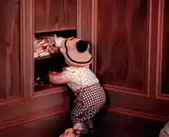 Toddler steals cookies from cabinet