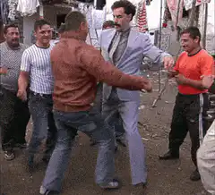 Man in suit dancing with crowd