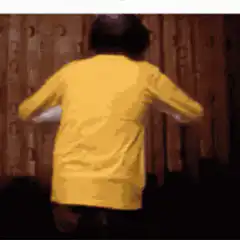 person glowing in yellow shirt