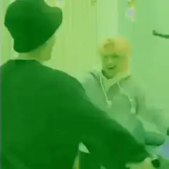 BTS members playing with a straw