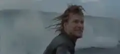 Sean Bean blowing smoke in the ocean