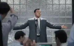 Tom Hanks preaching in a suit