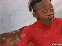 Man in red shirt dancing excitedly