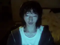 Person with messy hair looking down