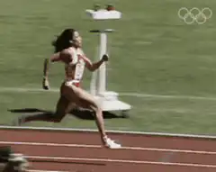 Female athlete running on track