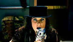 Woman smoking skull pipe