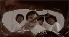 Man playing violin inside a giant mouth