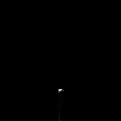 Spotlight beam on dark stage