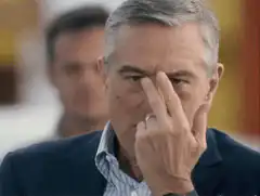 Robert De Niro rubbing his eye