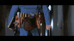 Jim Carrey as Ace Ventura Walking Down Hallway