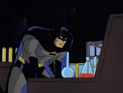 Batman knocks over beakers