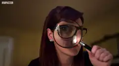 Woman looking through magnifying glass