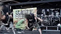 Suicide Silence band headbanging on stage