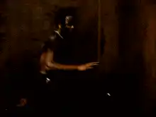 Man with face paint laughing maniacally