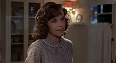 Young girl talking at dinner table