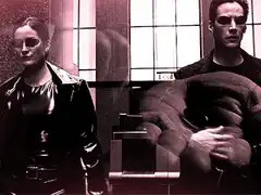 Trinity and Neo sitting with giant hands