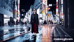 Woman walking in rainy neon city