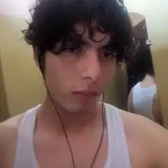 guy in white tank top with earphones