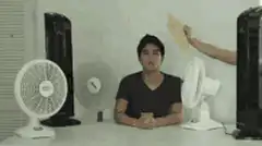 Man surrounded by fans with hand pointing