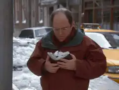 George Costanza throws snowballs at taxi