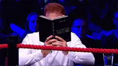 Man reads book and smiles