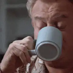 Man drinks coffee and eyes pop out