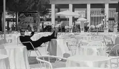 Man relaxing in chair at cafe