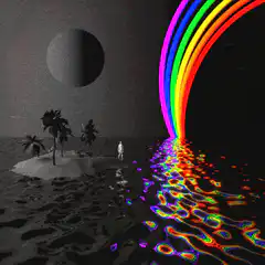 Rainbow waterfall on a dark beach