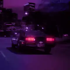 DeLorean driving at night