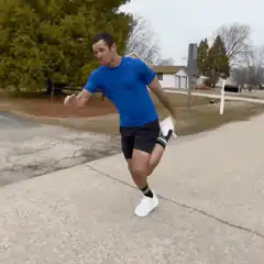 Man doing a funny hop on the street
