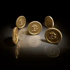 Gold Bitcoin coins on reflective surface
