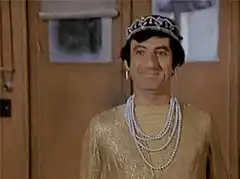 Mr. Bean in a tiara and pearls