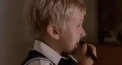 Boy draws mustache on himself