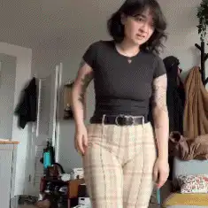 Woman in plaid pants dancing