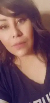 Woman holding a cucumber