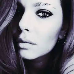 Close-up of a woman with dramatic makeup