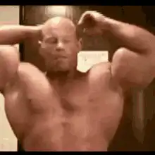 Bald man flexing muscles
