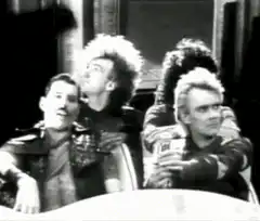 Queen band members looking up