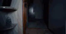 Man peeking through door