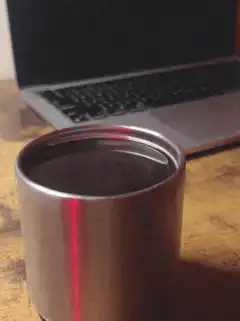 Steam rising from a metal cup