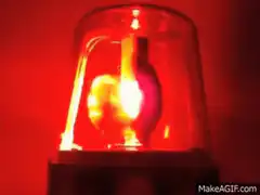 Red rotating emergency light flashing