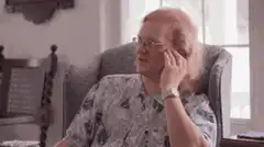 Old man facepalm in chair