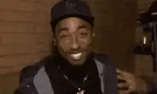 Tupac laughing and nodding