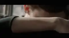 Tom Holland lifts head from arm