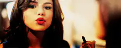 Selena Gomez puckering lips then smiling
