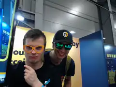 Two guys posing with funny glasses