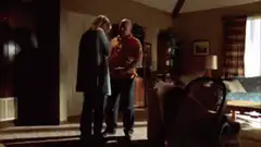 Man and woman hugging in living room