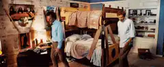 Two boys admire their new bunk bed