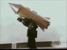 Man carrying a giant rocket